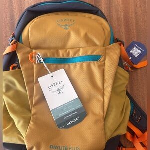 Osprey Gold and Black Adventure Backpack Durable Outdoor Design